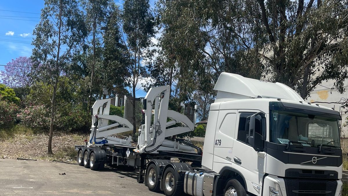 An Aardiv prime mover coupled to a side loader trailer