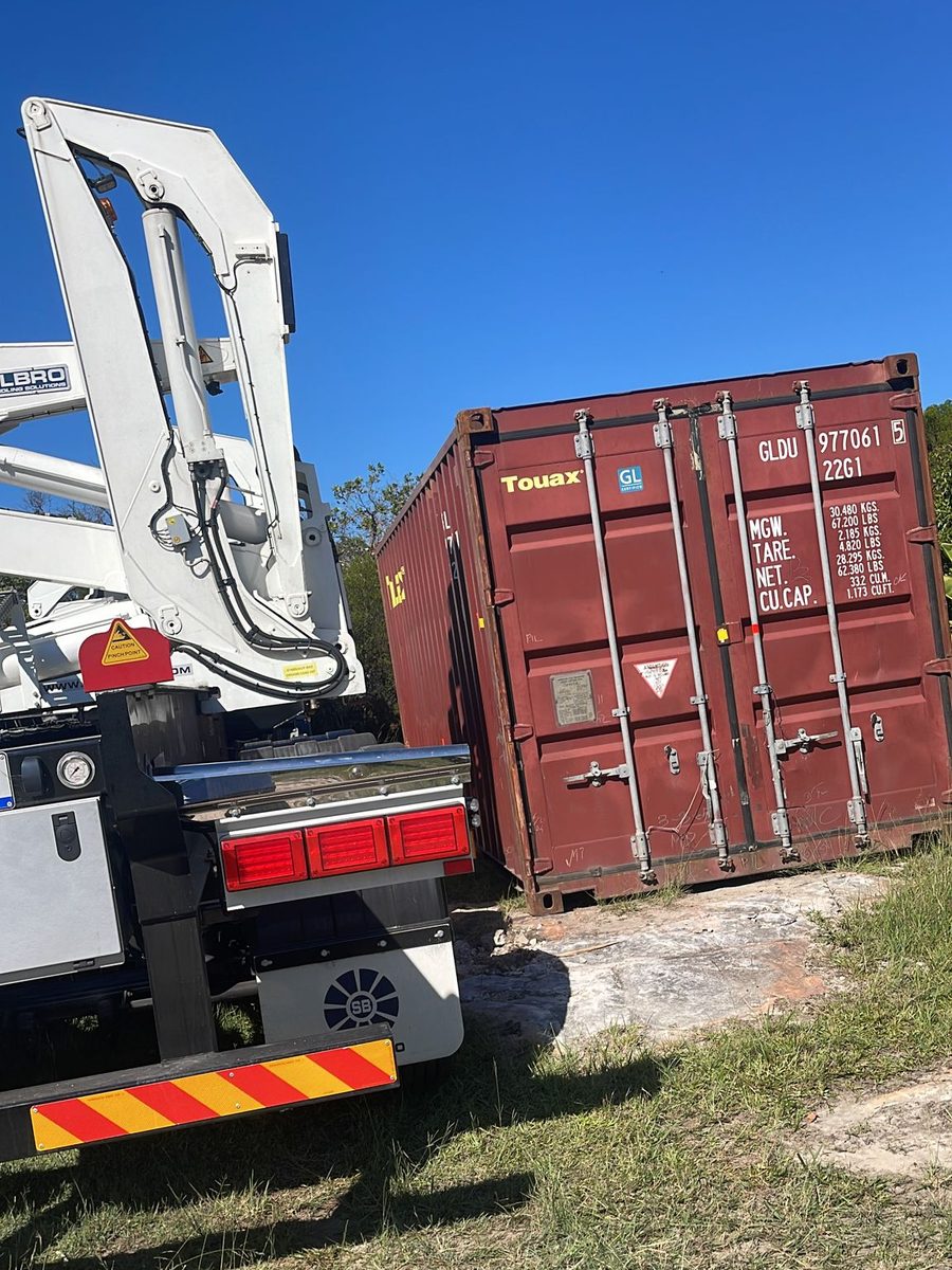 A side loader placing a container at a rural property outside Sydney